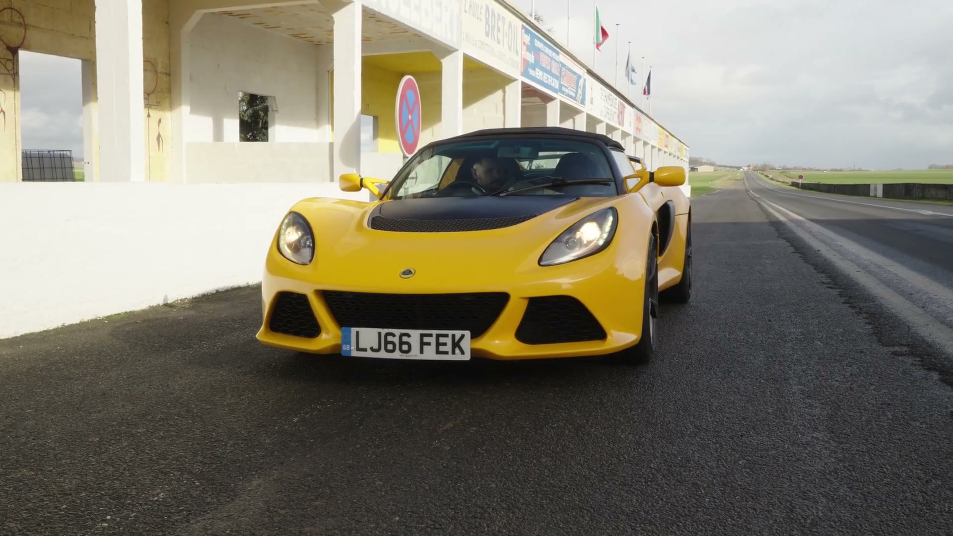 Black sports coupe driving on the road